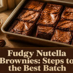 A plate of fudgy Nutella brownies drizzled with chocolate.